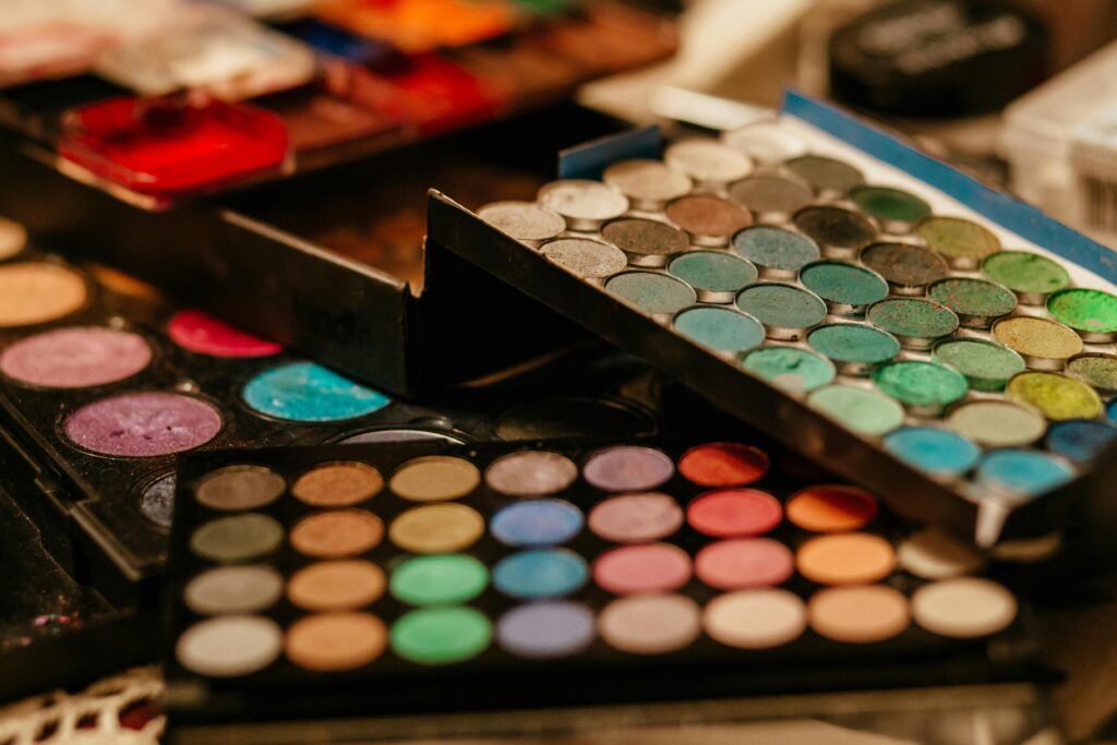 A vibrant close-up of assorted makeup palettes showcasing diverse colors and textures.